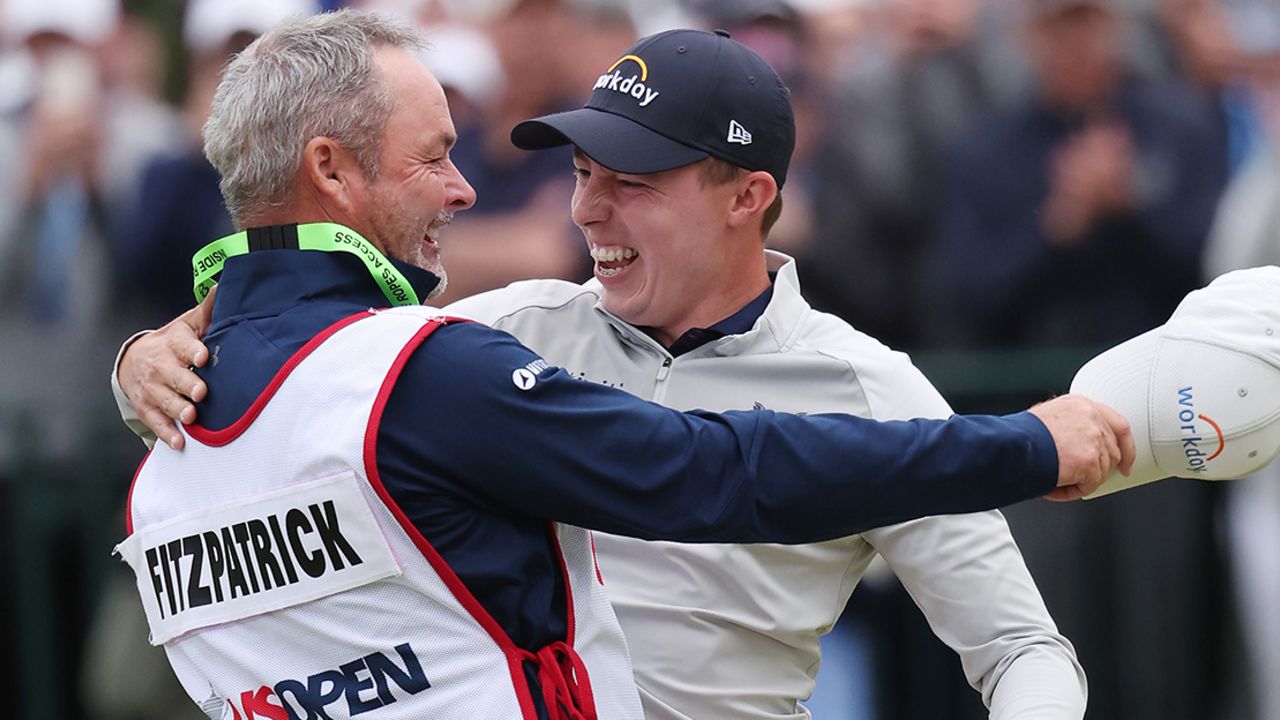 Matt Fitzpatrick of England celebrates with caddie Billy Foster after winning on the 18th green during the final round of the 122nd U.S. Open Championship at The Country Club on June 19, 2022, in Brookline, Massachusetts. 