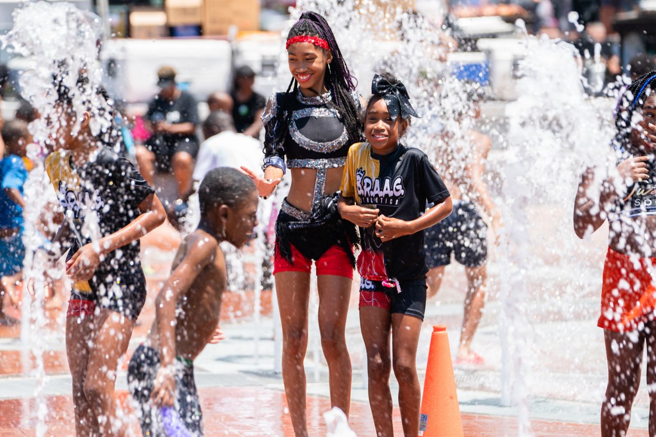 Children play in a fountain at Centennial Olympic Park in Atlanta during a Juneteenth celebration on Saturday.