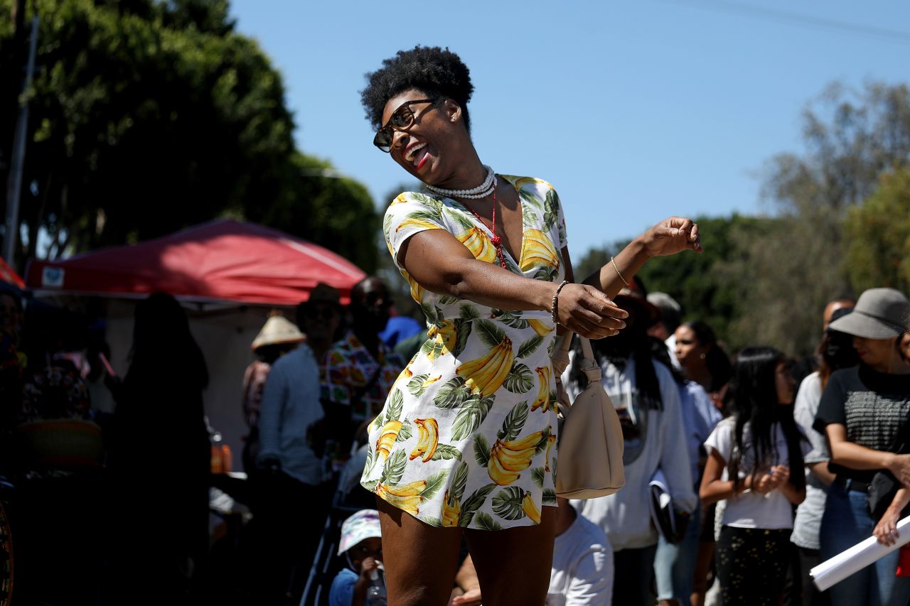 People dance to a drum circle at the Leimert Park Juneteenth Festival in Los Angeles on Saturday.