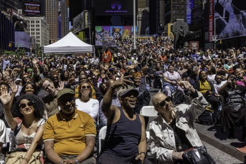 People attend a Juneteenth celebration in New York's Times Square on Sunday.