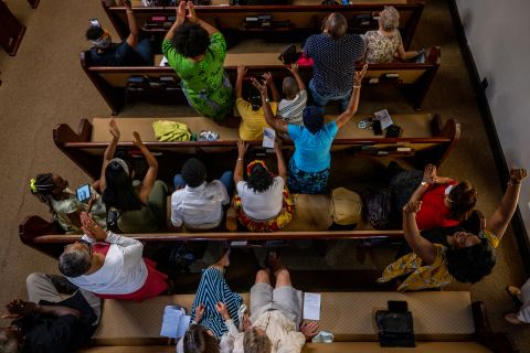 People participate in a service Sunday at the Reedy Chapel A.M.E. Church in Galveston.