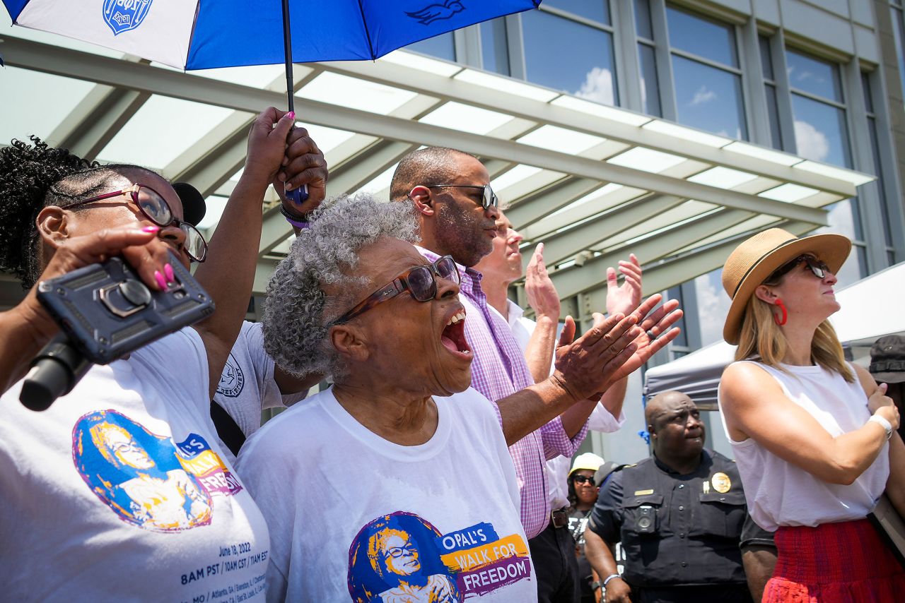 Opal Lee, center, cheers as the Juneteenth flag is raised at the Fort Worth City Hall in Texas at the conclusion of Opal's Walk for Freedom on Saturday. Lee, often referred to as the "Grandmother of Juneteenth" for her efforts to make it a federal holiday, led her annual 2.5-mile walk. It symbolizes the two and a half years that the enslaved African Americans of Galveston lived in captivity after President Abraham Lincoln issued the Emancipation Proclamation in 1863.
