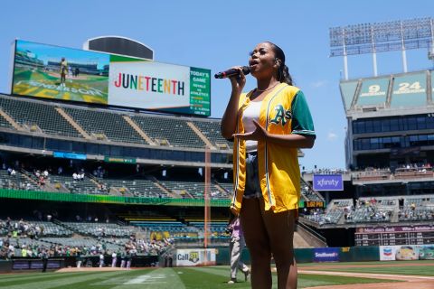 Nique performs "Lift Every Voice and Sing" before a Major League Baseball game in Oakland, California, on Sunday.