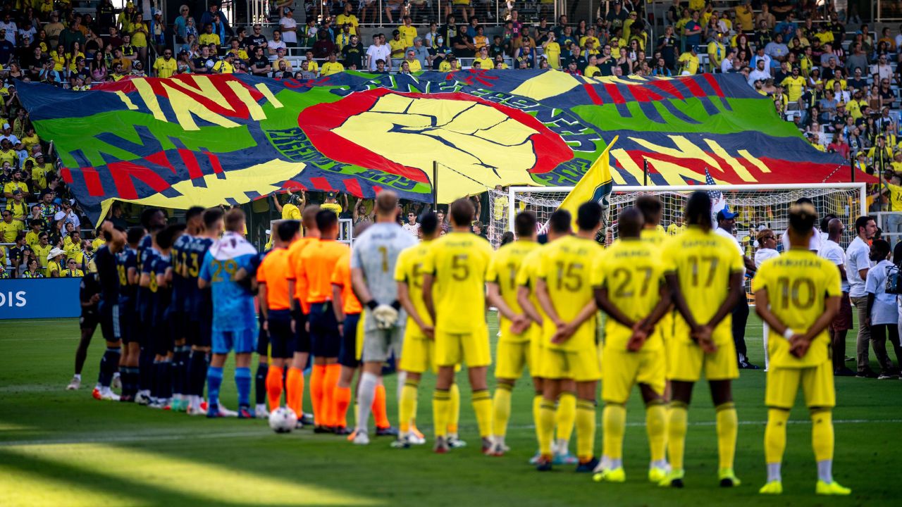 Supporters of the Major League Soccer club Nashville SC unveil a Juneteenth tifo before a match on Sunday.