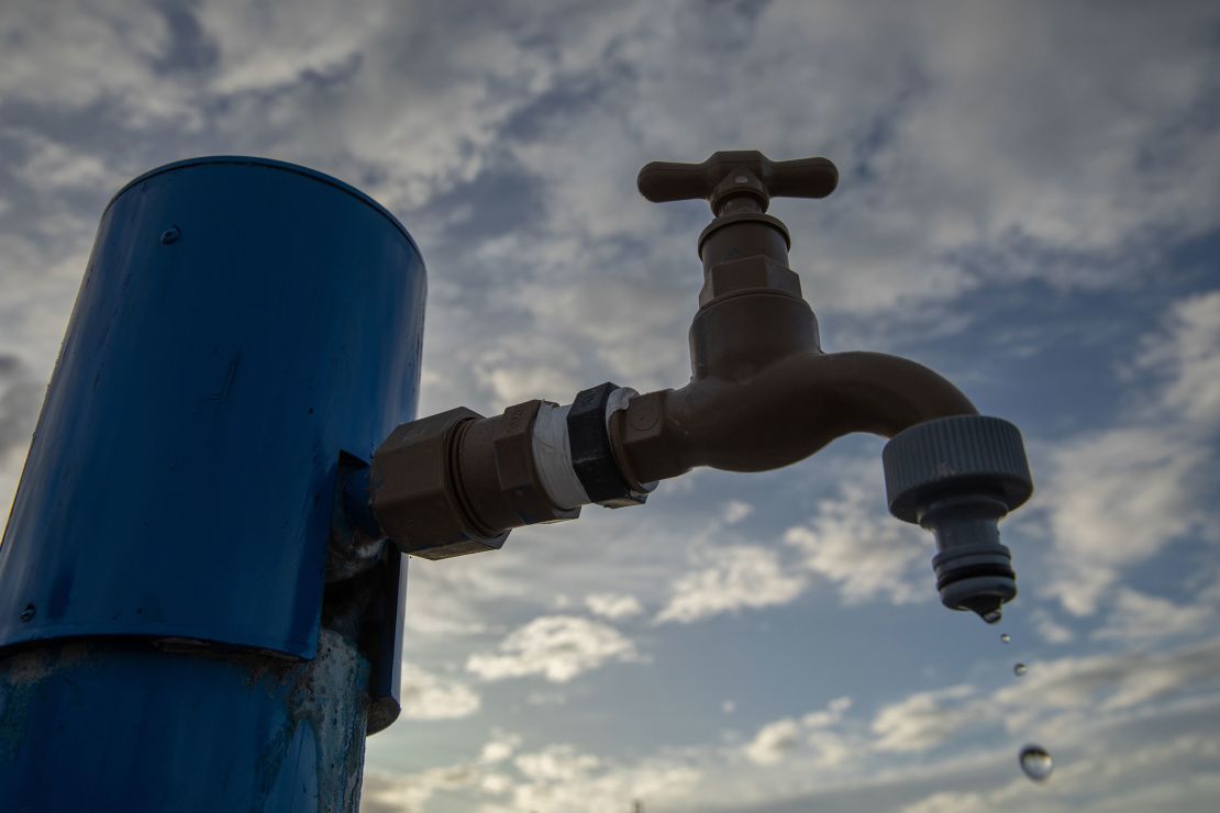 Water drips out of a tap at a water collection point in the Walmer suburb of Gqeberha, South Africa. It is one of many collection areas set up in the city.