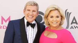 LAS VEGAS, NV - APRIL 02:  Todd Chrisley and Julie Chrisley arrive at the 52nd Academy of Country Music Awards held at T-Mobile Arena on April 2, 2017 in Las Vegas, Nevada.  (Photo by Michael Tran/FilmMagic)