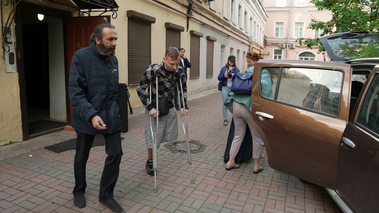 Vladimir Shishkin uses crutches to walk after losing his left leg in the conflict.