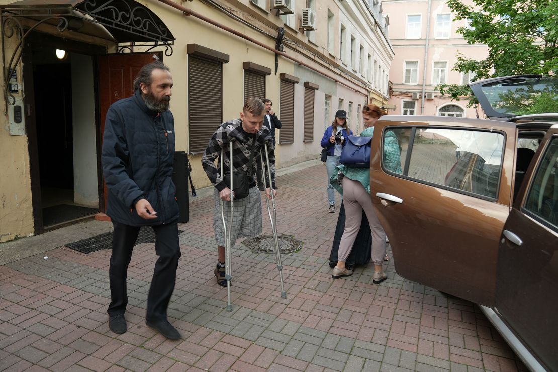 Vladimir Shishkin uses crutches to walk after losing his left leg in the conflict.