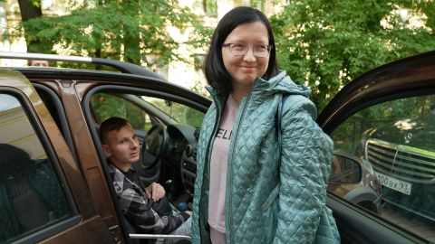 Viktoria Shishkina smiles as she and husband Vladimir get ready to leave for Germany.