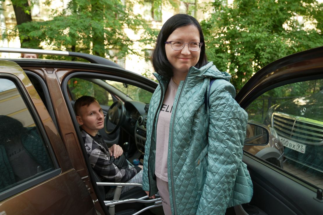 Viktoria Shishkina smiles as she and husband Vladimir get ready to leave for Germany.