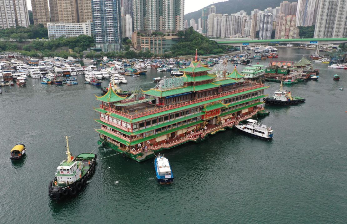 Hong Kong's Jumbo Floating Restaurant, an iconic but aging tourist attraction designed like a Chinese imperial palace, is towed out of Aberdeen Harbor on June 14, 2022.