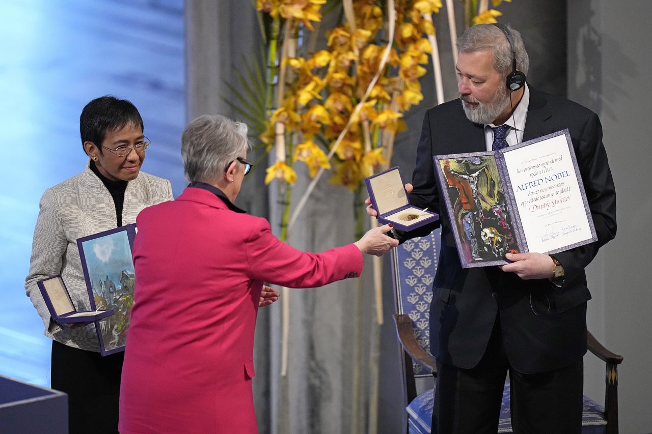 Nobel Peace Prize winners Dmitry Muratov from Russia, right, and Maria Ressa of the Philippines receive their awards during the Nobel Peace Prize ceremony at Oslo City Hall, Norway, in December 2021.