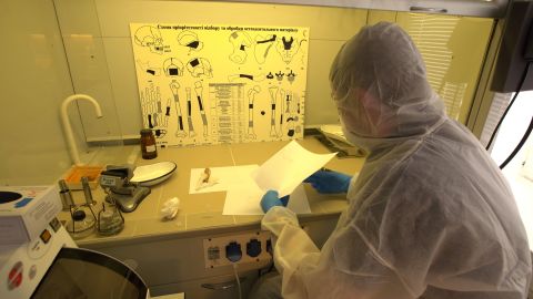 Analysts at the Ministry of Internal Affairs' laboratory in Kyiv process DNA samples.