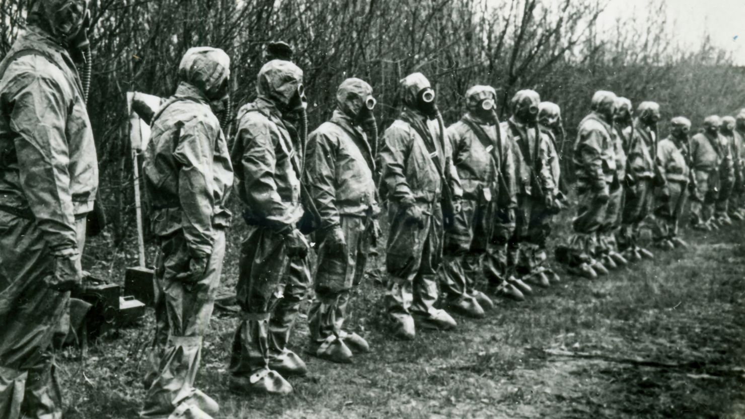 Liquidators lining up in their protective equipment in 'Chernobyl: The Lost Tapes.'
