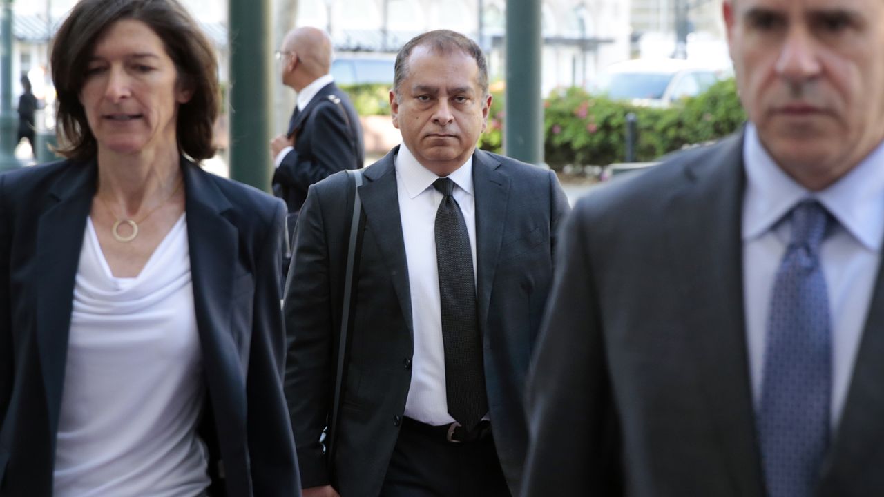 Former Theranos COO Ramesh "Sunny" Balwani (C) arrives at the Robert F. Peckham U.S. Federal Courthouse on June 21, 2022.
