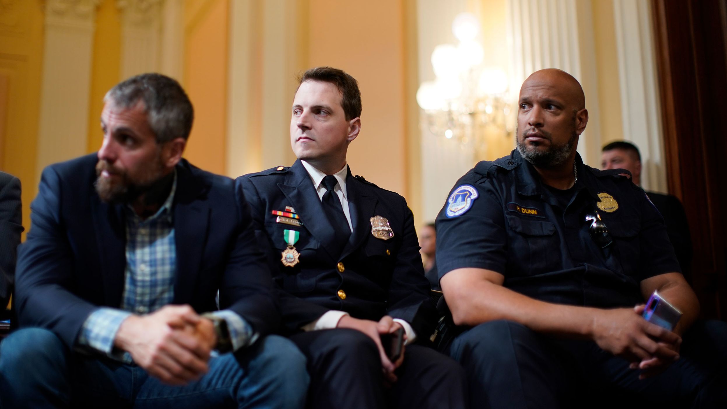 From left, former Metropolitan Police Department officer Michael Fanone, Metropolitan Police Department officer Daniel Hodges and Capitol Police officer Harry Dunn attend the hearing on June 21. They helped defend the Capitol during the attack.