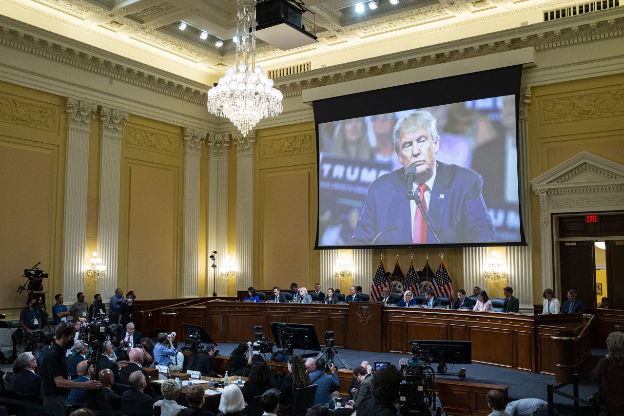 Video of Trump is seen over the committee during the hearing on June 21.