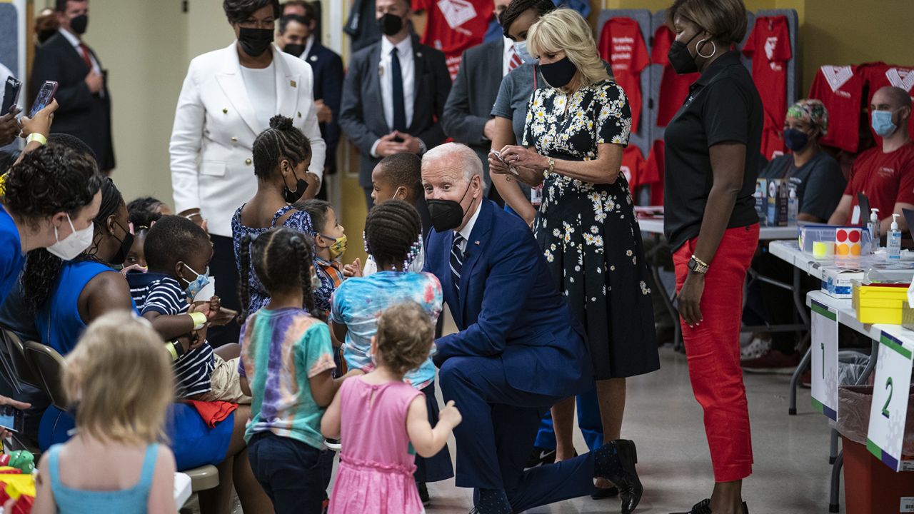US President Joe Biden speaks with children while visiting a Covid-19 vaccination clinic hosted by the District of Columbia's Department of Health in Washington, D.C., U.S., on Tuesday, June 21, 2022. Infants and toddlers in the US are now able to be vaccinated against Covid-19 after shots from Moderna and Pfizer won support from health advisers on Saturday. 