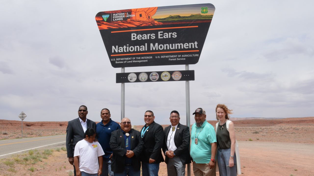 USDA's Under Secretary for Natural Resources and Environment Homer Wilkes, far left, representatives of five Native American tribes, and Tracy Stone-Manning, director of the Bureau of Land Management, far right, are pictured in front of the newly installed Bears Ears National Monument sign on June 18, 2022.