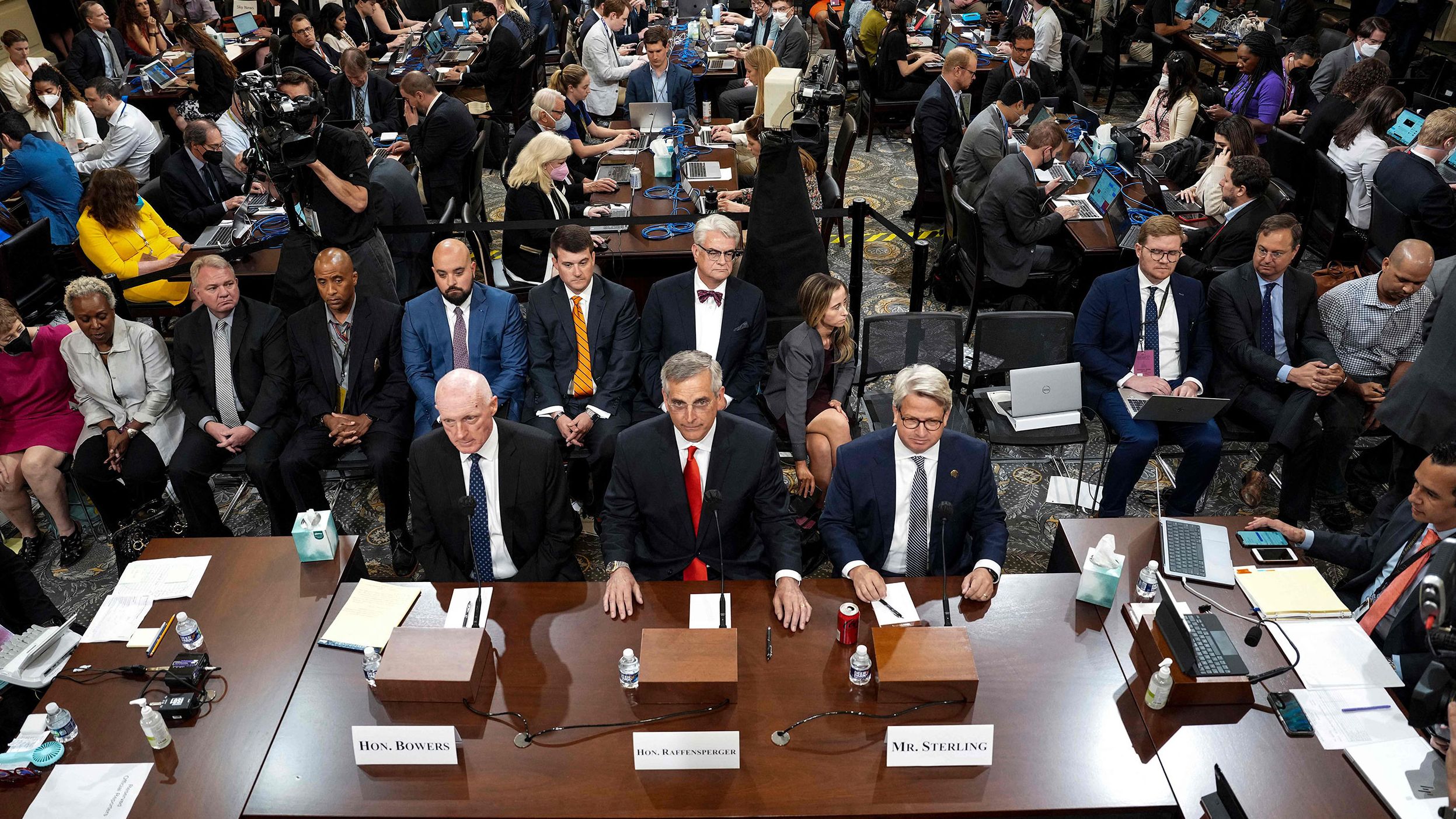 From left, Bowers, Raffensperger and Sterling arrive for the hearing on June 21.