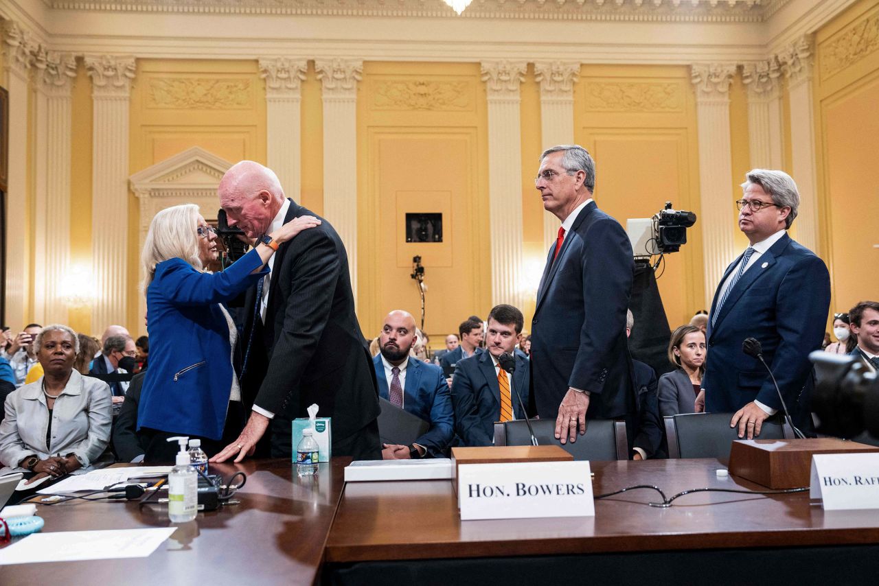 Arizona House Speaker Rusty Bowers is hugged by Cheney after his testimony at a January 6th hearing in June 2022. Bowers, a Republican, defied a scheme to overturn the election results in his state, and he gave emotional testimony about the impact that had. <a href="https://www.cnn.com/politics/live-news/january-6-hearings-june-21/h_29dae2b5e7e4b560fa75d919562ec68e" target="_blank">He described "disturbing" protests outside his home,</a> and he read a passage from his personal journal about friends who had turned on him. 