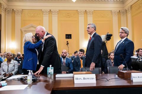 Arizona House Speaker Rusty Bowers is hugged by US Rep. Liz Cheney, the vice chairwoman of the House select committee investigating the January 6, 2021 attack on the US Capitol, after his testimony on Tuesday, June 21. Bowers, a Republican, defied a scheme to overturn the election results in his state, and he gave emotional testimony about the impact that had. <a href=