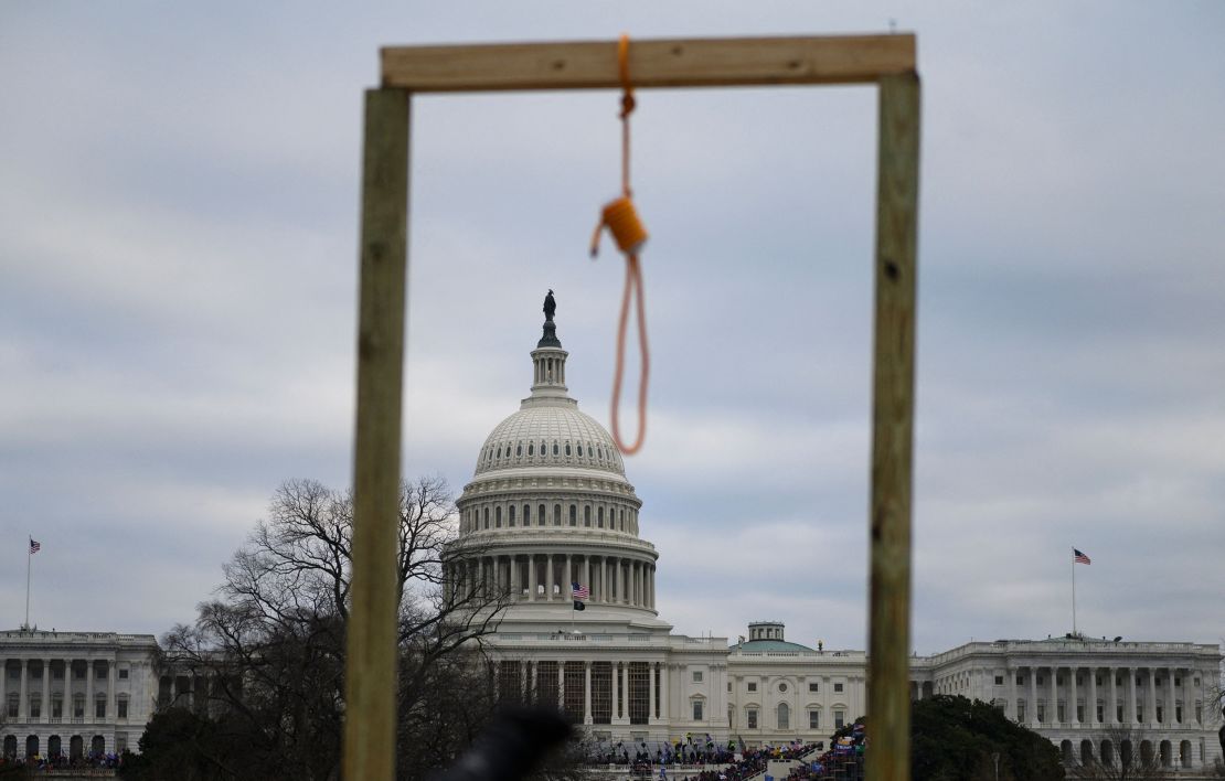 TOPSHOT - A noose is seen on makeshift gallows as supporters of US President Donald Trump gather on the West side of the US Capitol in Washington DC on January 6, 2021. - Donald Trump's supporters stormed a session of Congress held today, January 6, to certify Joe Biden's election win, triggering unprecedented chaos and violence at the heart of American democracy and accusations the president was attempting a coup. (Photo by Andrew CABALLERO-REYNOLDS / AFP) (Photo by ANDREW CABALLERO-REYNOLDS/AFP via Getty Images)