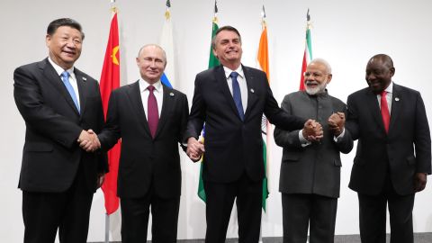 Chinese President Xi Jinping, Russian President Vladimir Putin, Brazilian President Jair Bolsonaro, India's Prime Minister Narendra Modi and South African President Cyril Ramaphosa pose during a BRICS meeting held during a G20 summit in Osaka in June 2019. 