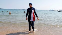 FILE PHOTO: 70th Cannes Film Festival - Cannes, France. 27/05/2017. Karima, wearing a full-body burkini swimsuit, walks on a beach in Cannes after the call to support the wearing of burkinis by businessman and political activist Rachid Nekkaz.  REUTERS/Eric Gaillard/File Photo