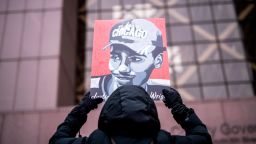 MINNEAPOLIS, MN - FEBRUARY 18: A demonstrator holds up a portrait of Daunte Wright outside the Hennepin County Government Center during the sentencing hearing for former Brooklyn Center police officer Kim Potter on February 18, 2022 in Minneapolis, Minnesota. Potter was convicted on two counts of manslaughter in the killing of Wright last year. (Photo by Stephen Maturen/Getty Images)