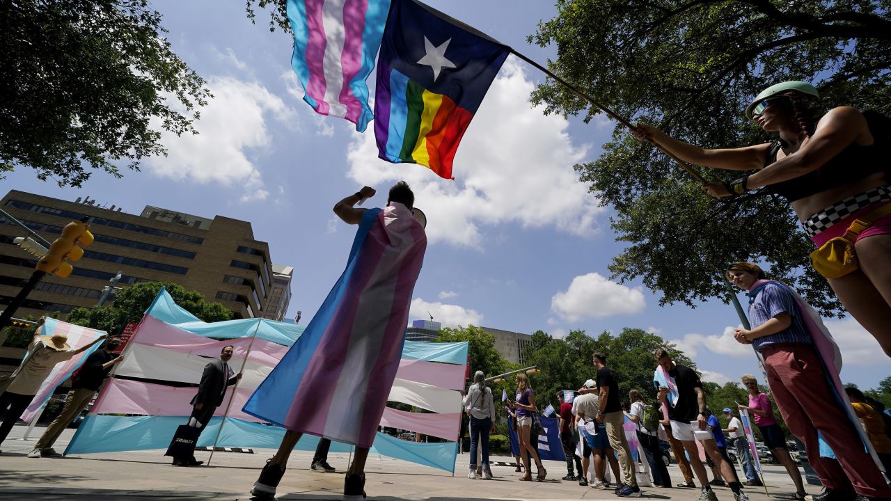 Demonstrators gather on the steps to the State Capitol to speak against transgender-related legislation  being considered in the Texas Senate and Texas House, May 20, 2021, in Austin, Texas. 