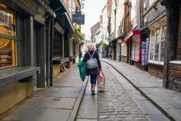 A shopper walks along the Shambles in York, UK, on Monday, June 20, 2022. Inflation hit a 40-year high last month to 9.4%. Photographer: Ian Forsyth/Bloomberg via Getty Images