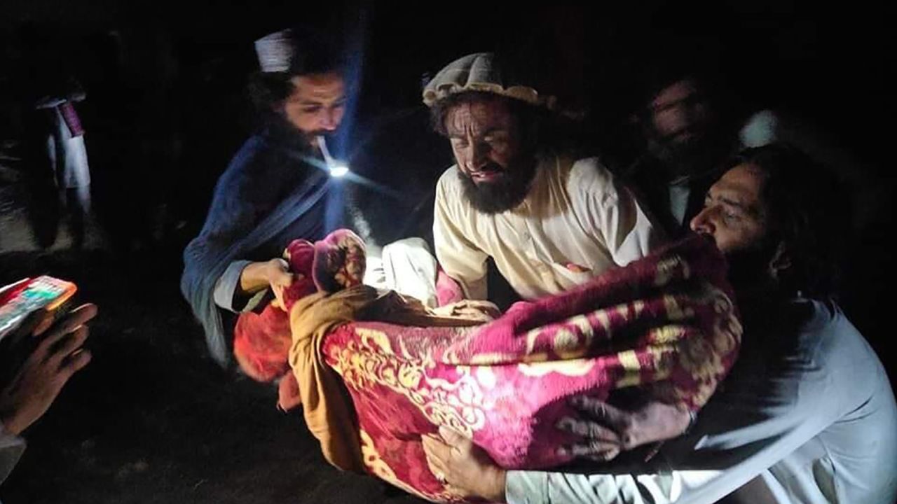 In this photo released by state-run news agency Bakhtar, Afghans evacuate the wounded following the quake in Paktika province, eastern Afghanistan.