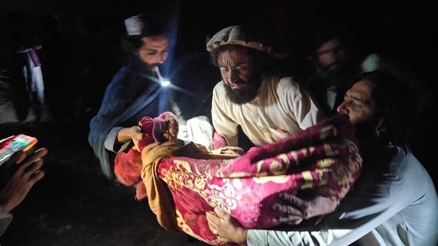 Villagers evacuate an injured earthquake victim in Afghanistan's Paktika province. 