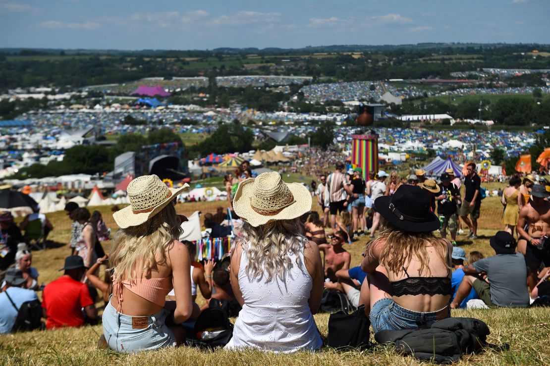 Glastonbury Festivalgoers enjoy the sun and warm weather on Wednesday.