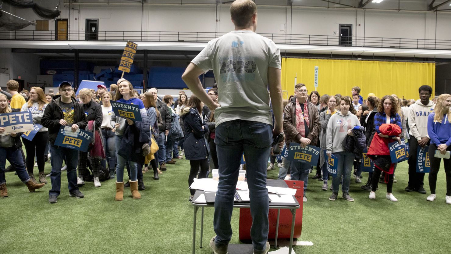 In this February 3, 2020, file photo, a caucus chair looks over a group of Pete Buttigieg supporters during the first-in-the-nation Iowa caucuses at the Drake University Knapp Center arena in Des Moines, Iowa.