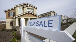 A For Sale sign is posted in front of a home in Sacramento, Calif., Thursday, March 3, 2022. 