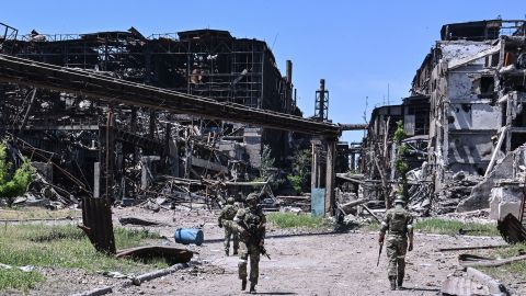 Russian servicemen patrol near the Azovstal steel plant in Mariupol on June 13, 2022.