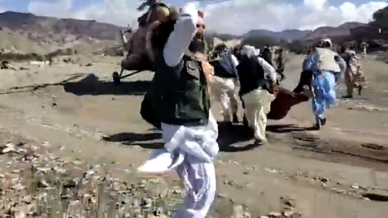 shows Afghans trying to leave in helicopters after deadly quake