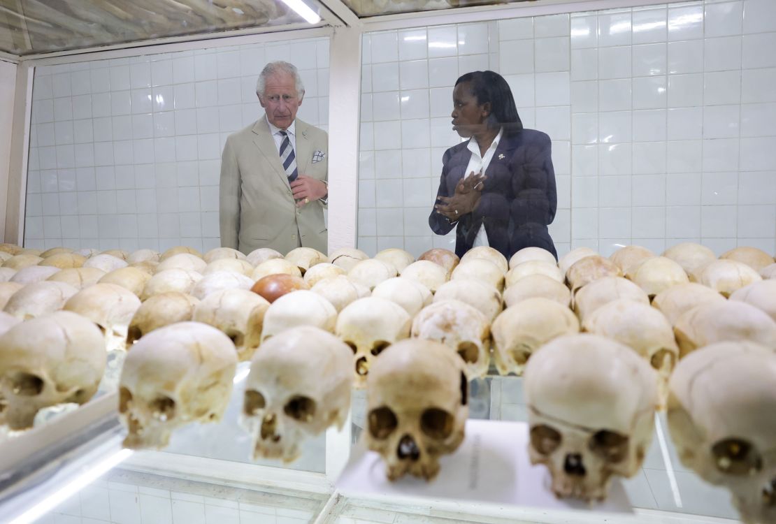Prince Charles looks at the skulls of victims of the massacre.