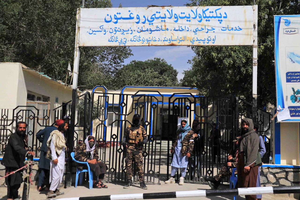 Taliban guards outside the district hospital where victims of the earthquake were brought in Paktia, Afghanistan, on June 22.