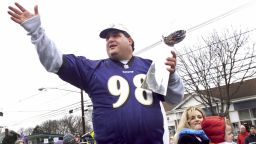 Tony Siragusa holds the trophy given to the Super Bowl winner during a parade in his hometown of Kenilworth, New Jersey on March 4, 2001. 
