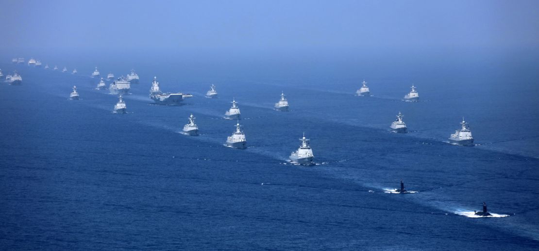 China's Liaoning aircraft carrier is accompanied by navy frigates and submarines during an exercise in the South China Sea.