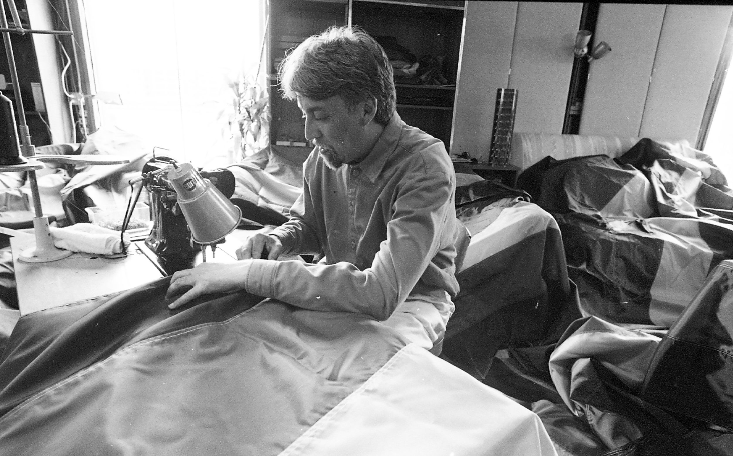 Gilbert Baker, the artist who designed the Rainbow Flag, making 500 new flags for an installation in 1998.