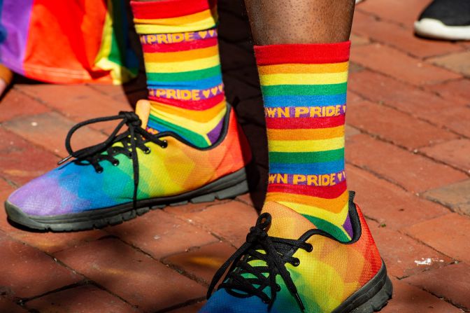 An attendee wears rainbow socks and shoes during a rally in Provincetown, Massachusetts, on June 4, 2022. 