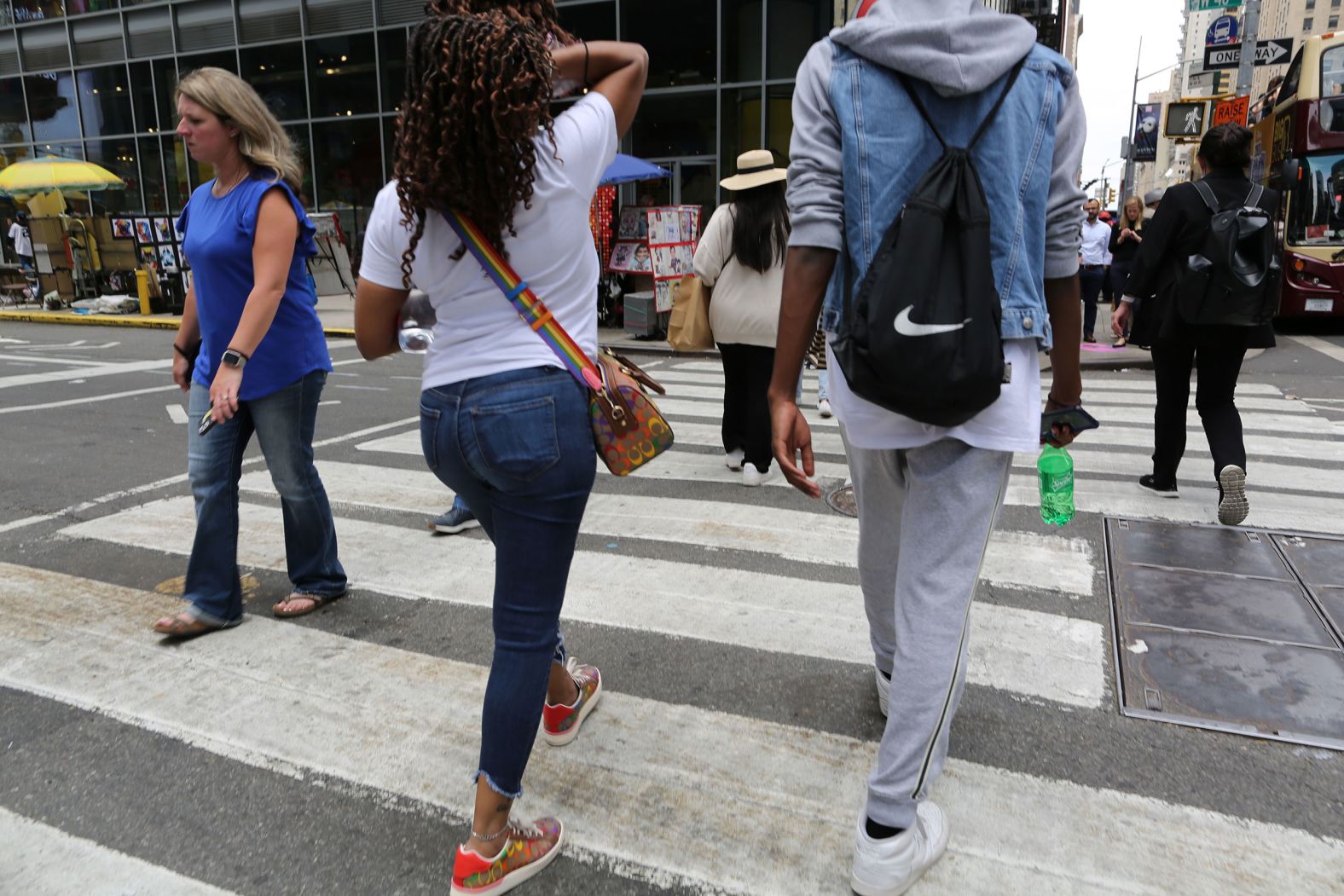 A pedestrian with a Coach bag in New York City in June of 2022. The fashion brand released a 2022 Pride collection featuring bags, clothing and accessories adorned in the rainbow flag. 