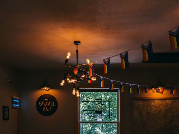 Pride flags are seen in The Gravel Bar at Wanderloo Lodge in Eureka Springs, Arkansas, on June 21, 2022.