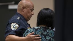 May 24, 2022; Uvalde, TX, USA; Uvalde school police chief Pete Arredondo hugs Ann Marie Espinoza, Uvalde School District's executive director of communications and marketing, after the press conference following the shooting at Robb Elementary School in Uvalde, Texas on Tuesday, May 24, 2022.  Mandatory Credit: Mikala Compton-USA TODAY NETWORK