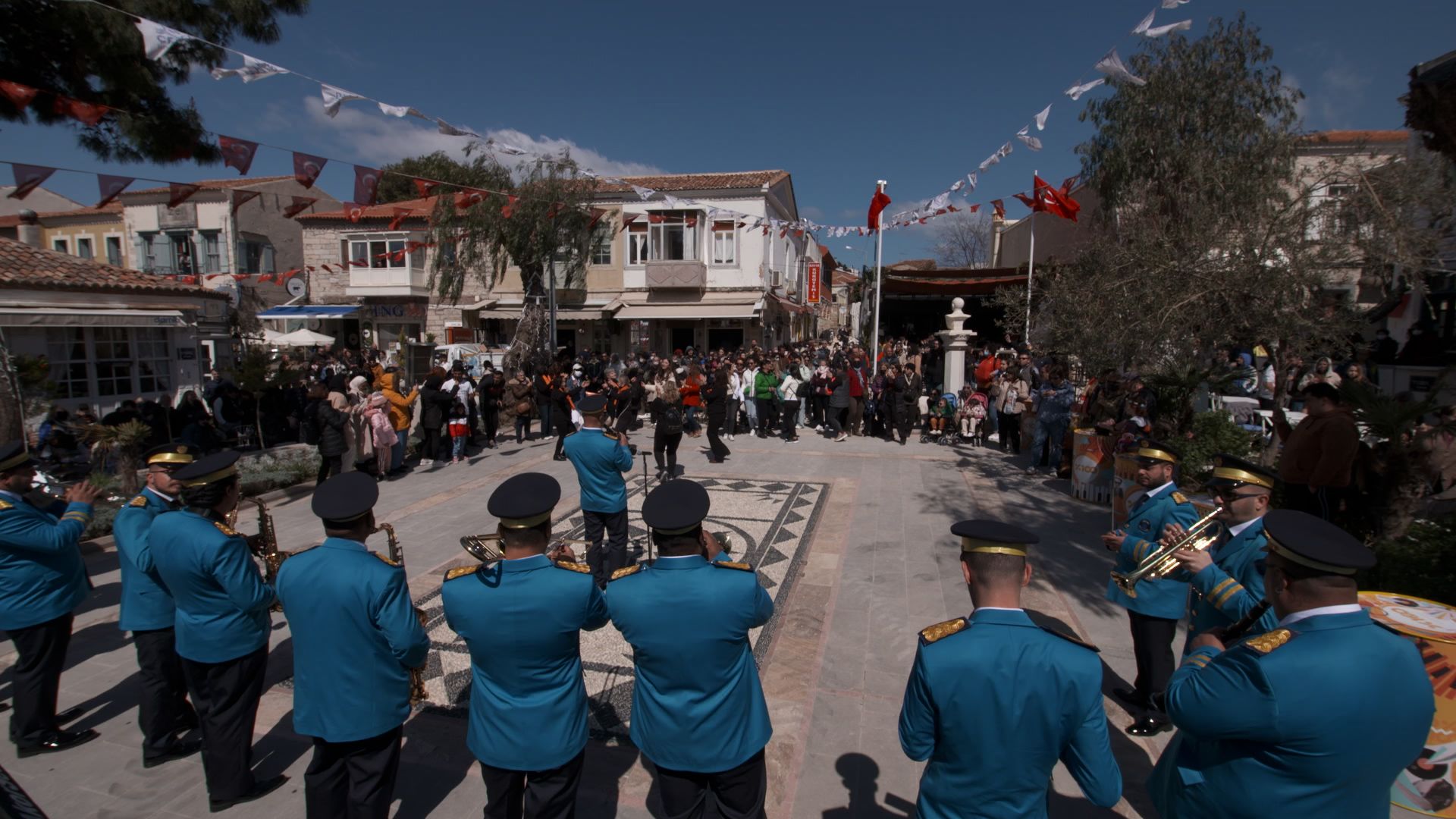 <strong>Lively atmosphere:</strong> A brass band entertains the crowd with traditional Turkish songs in the main square  during the annual Alacati Herb Festival.