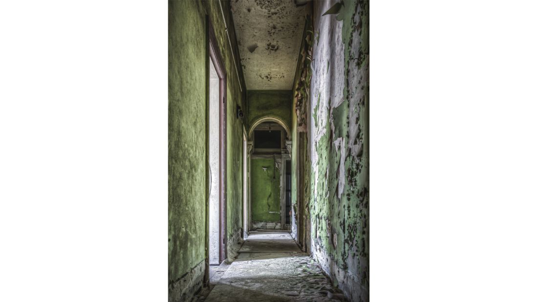 <strong>Terminus Hotel:</strong> This hallway connected the main bar to the dining room in the hotel's heyday. Patman points out the visible lead paint in this image.